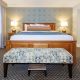 A New England Inn Room with a touch of modern luxury in the Country King Suite.