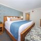 A plush king bed adorned with high-quality linens