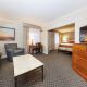 Relaxing sitting area with a sleeper sofa, and modern amenities for your comfort.